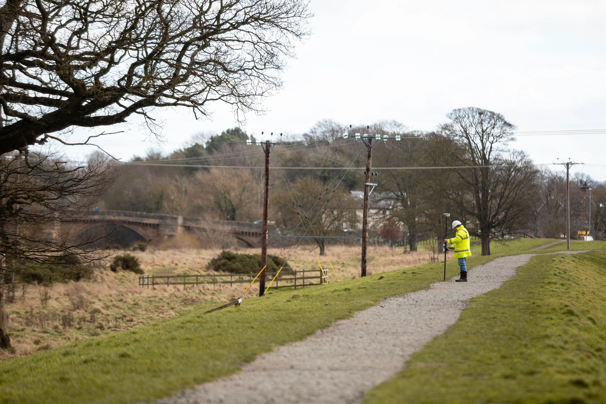 Engineer surveying a site with mapping equipment