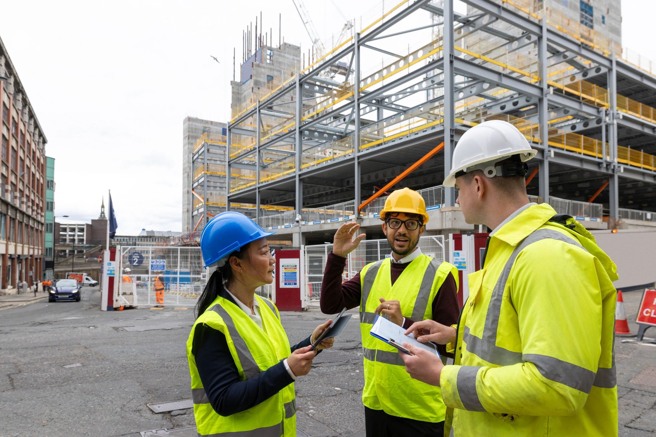 Team reviewing construction plans on site