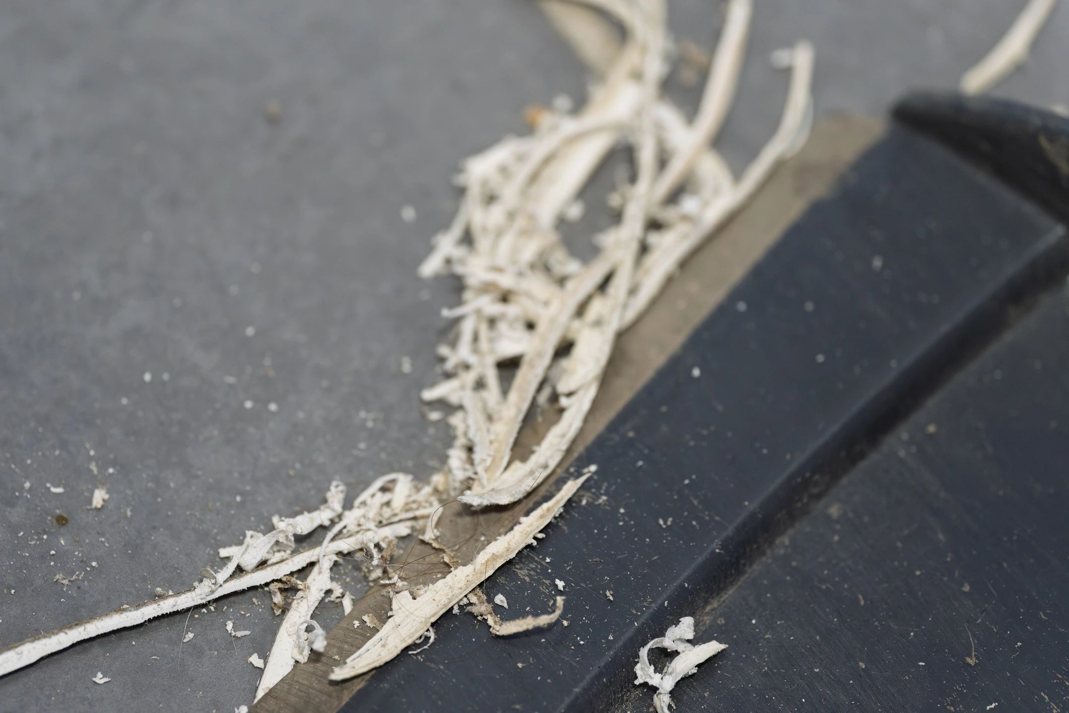 Close-up of sealant joint being prepared for replacement